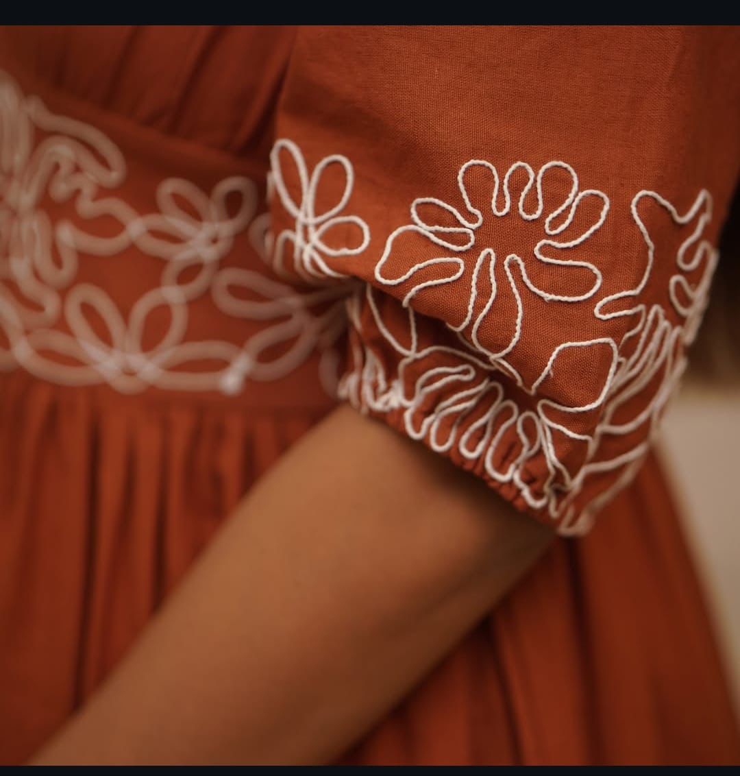 Chic and trendy rust orange knee-length dress